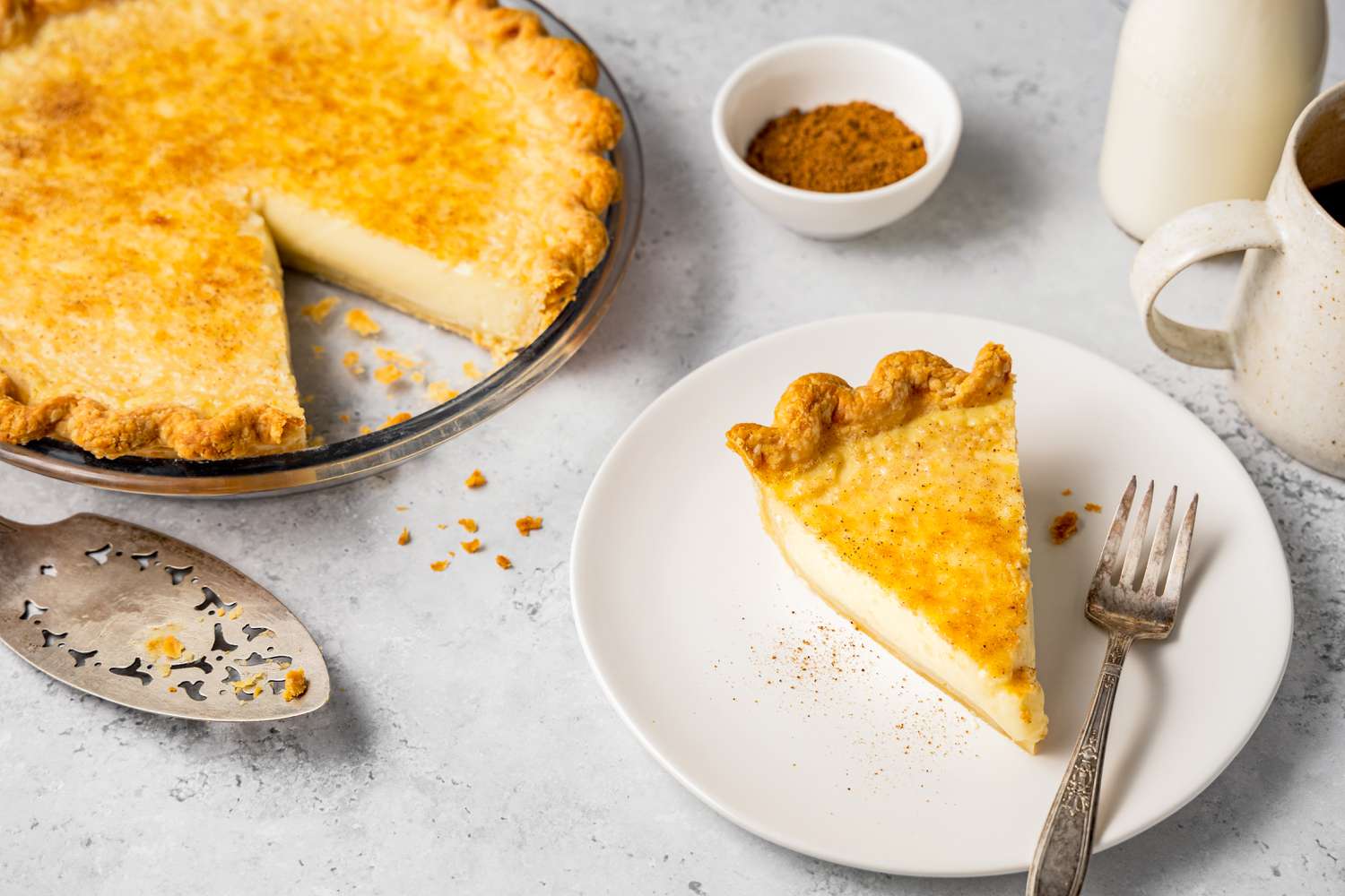 Egg Custard Pie with a Serving on a Plate with a Fork