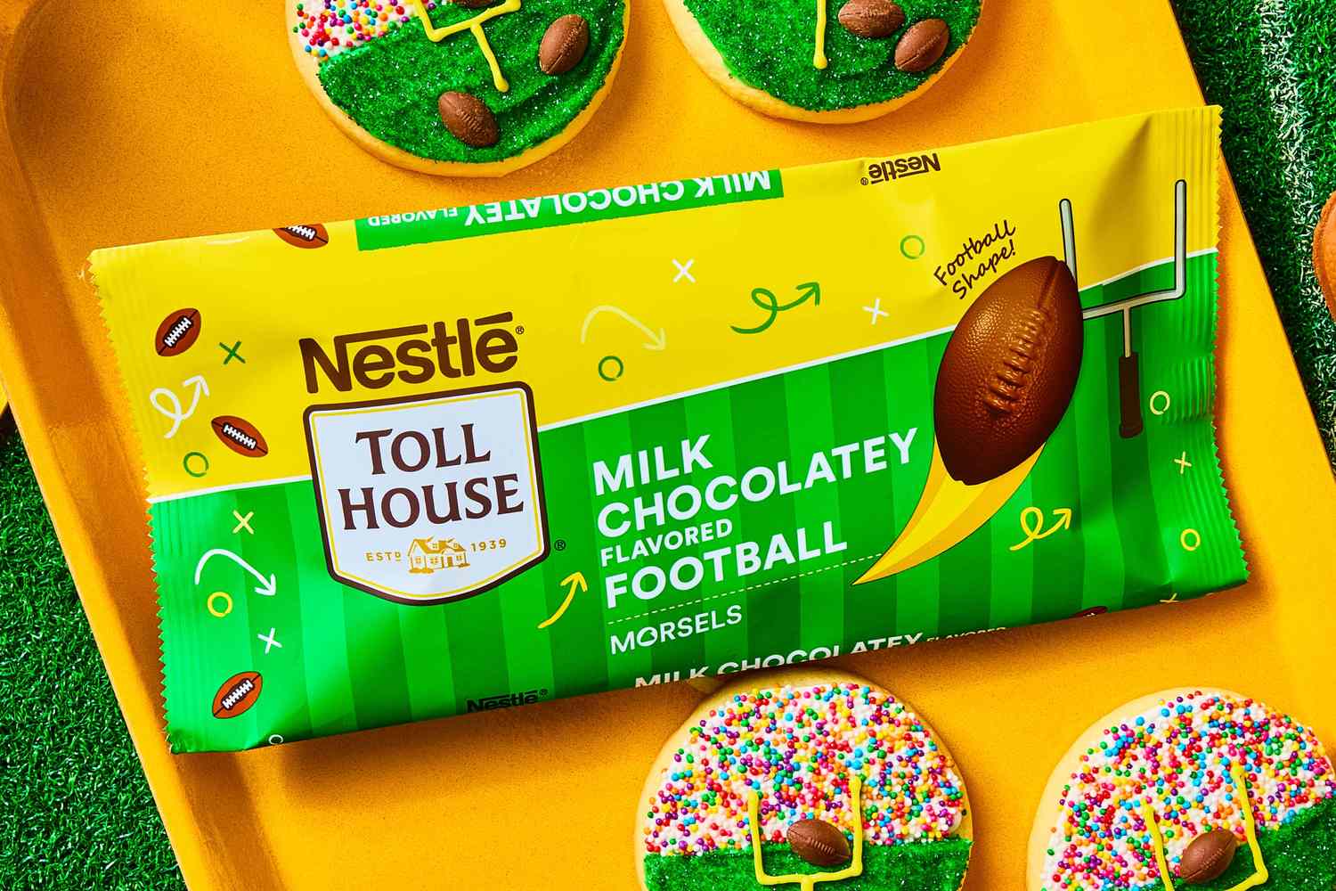 Nestle Toll House Milk Chocolatey Football Morsels packaging surrounded by cookies with football and sprinkle designs