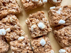 Cinnamon flavored crispy rice treats with marshmallows on a surface