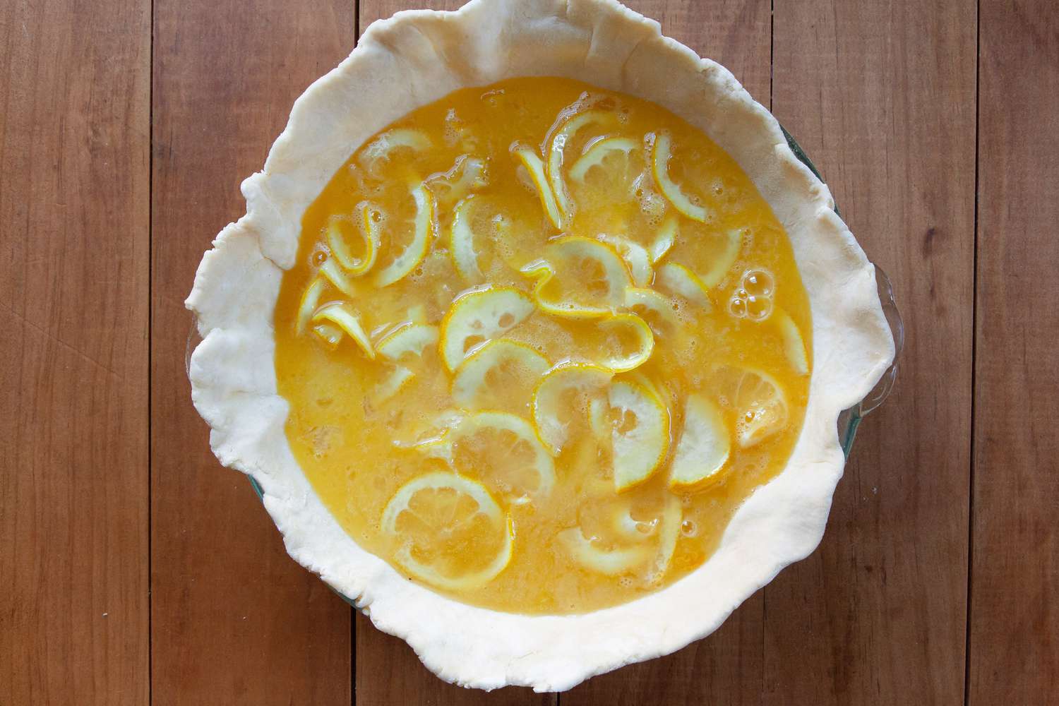 Shaker Lemon Pie filling in an unbaked pie crust.