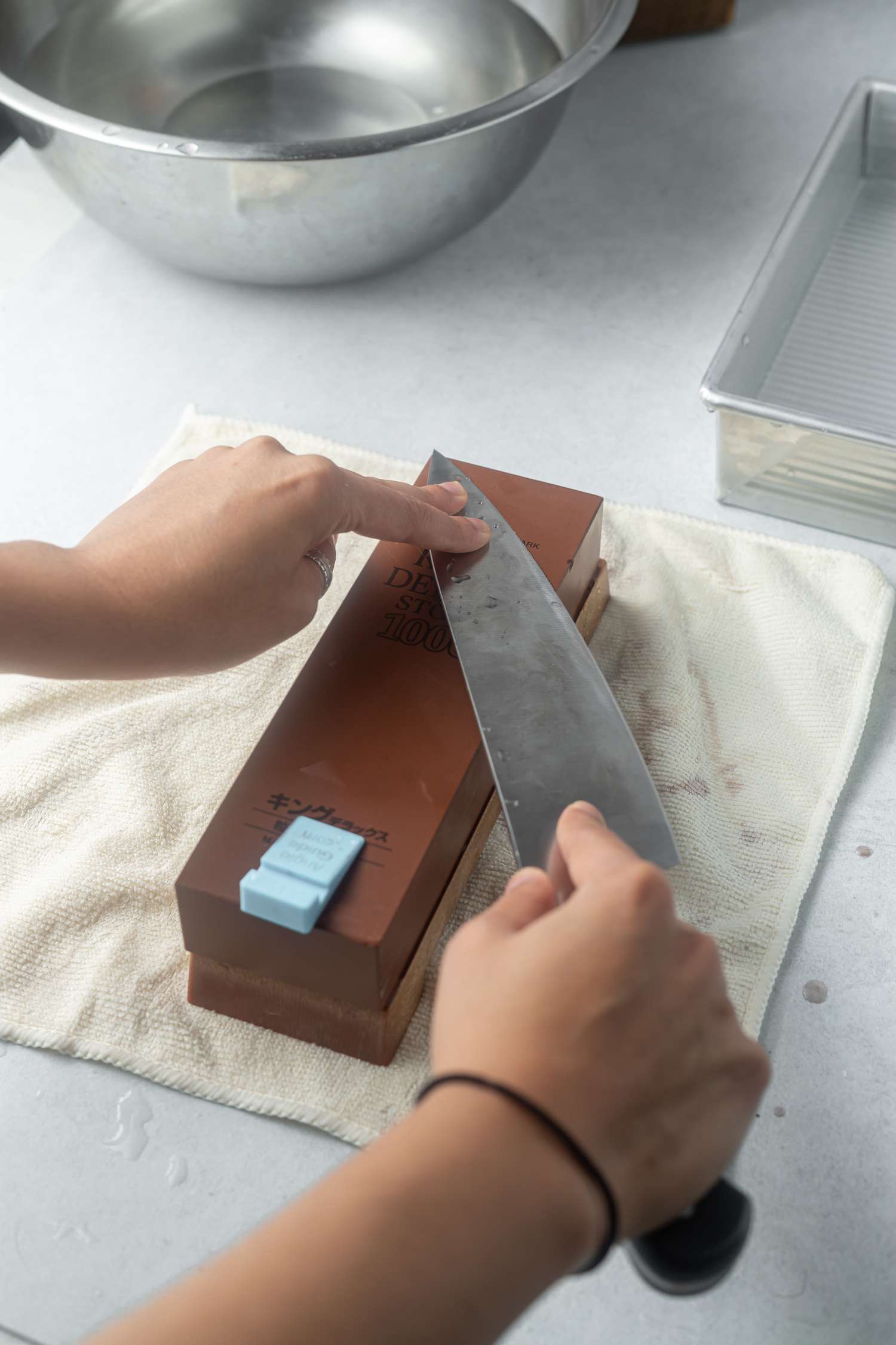 Sharpening a knife on a whetstone