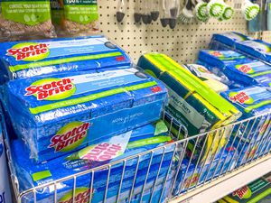 packages of scotch brite sponges and other kitchen cleaning supplies on store shelves 