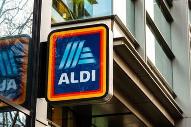 A sign with the Aldi logo on a building