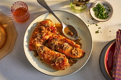 Platter of chicken marsala on a kitchen counter