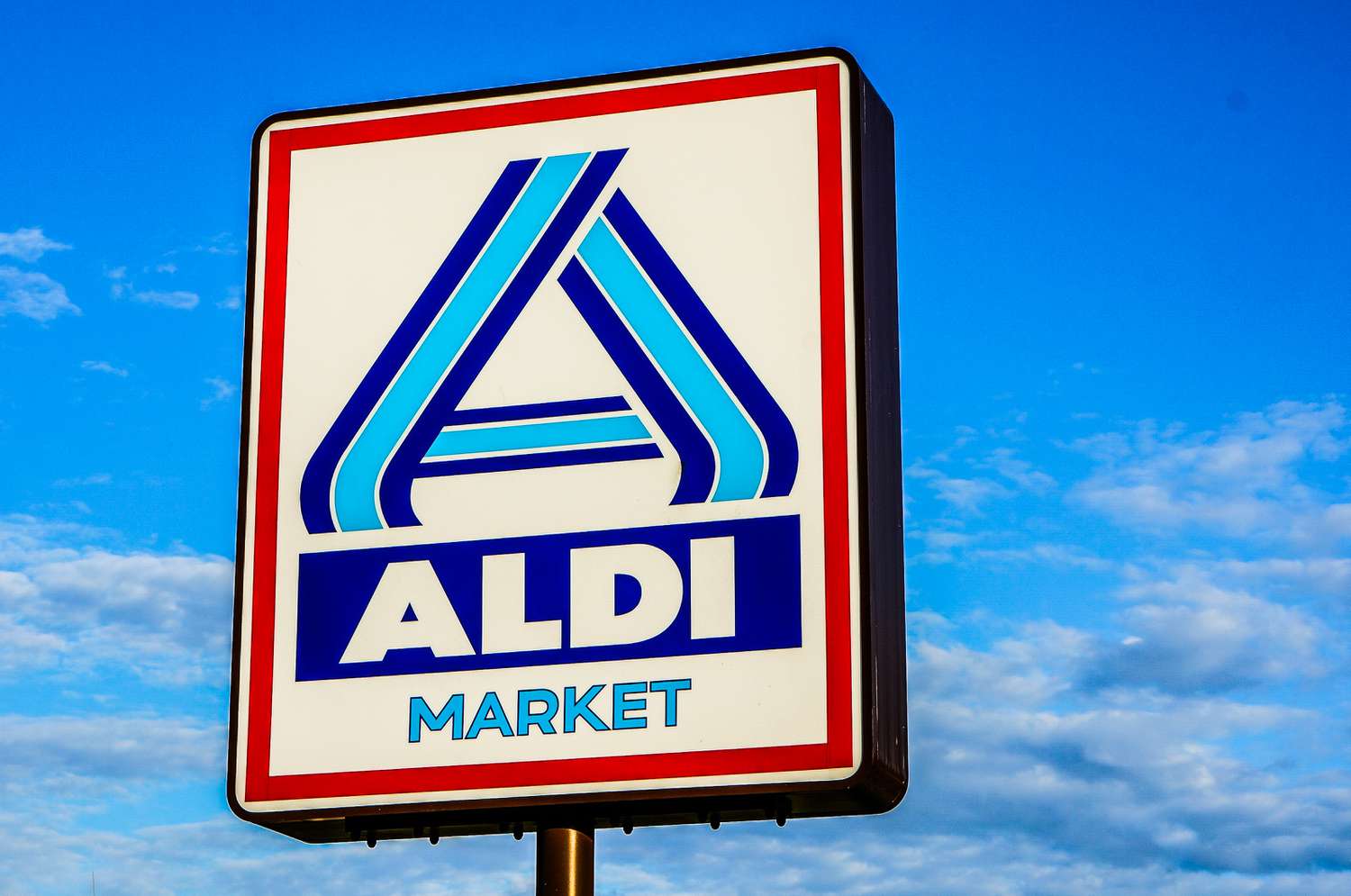 Aldi Market supermarket sign and a blue sky