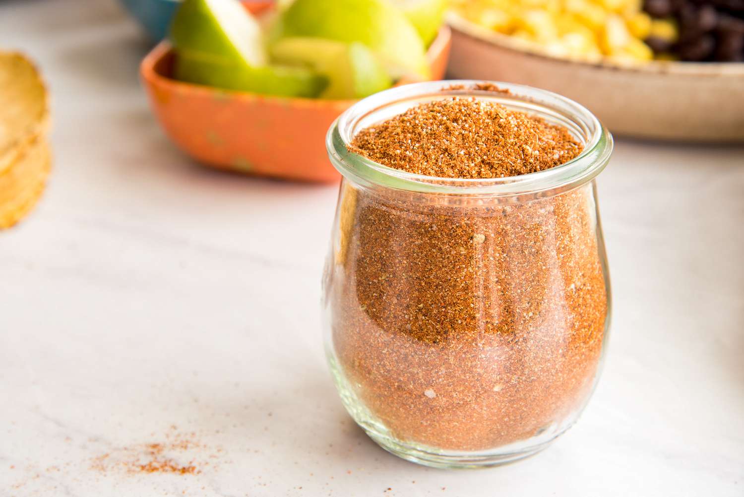 Taco Seasoning in Jar Surrounded by Taco Ingredients
