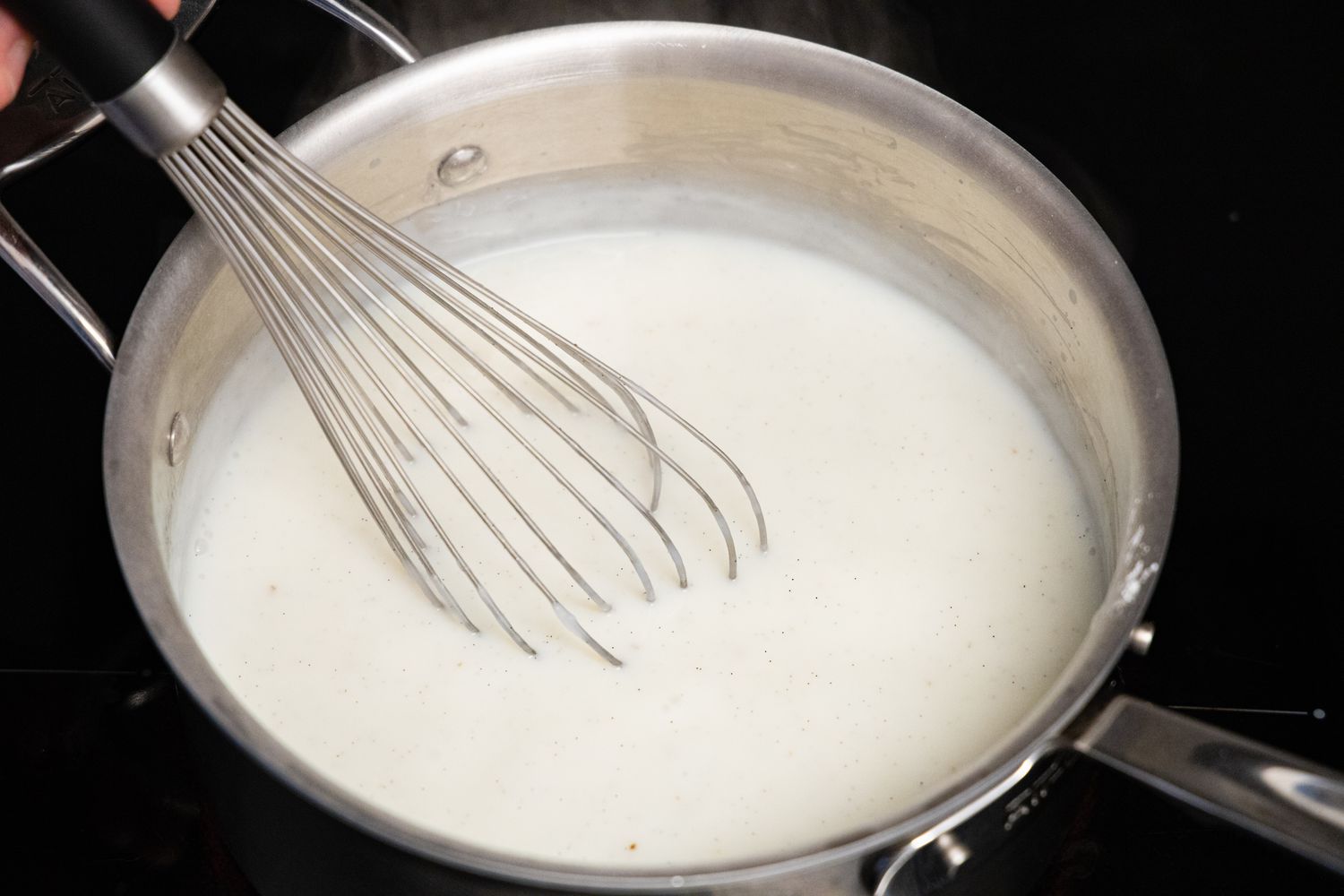 Homemade Vanilla Pudding Whisked in a Pot
