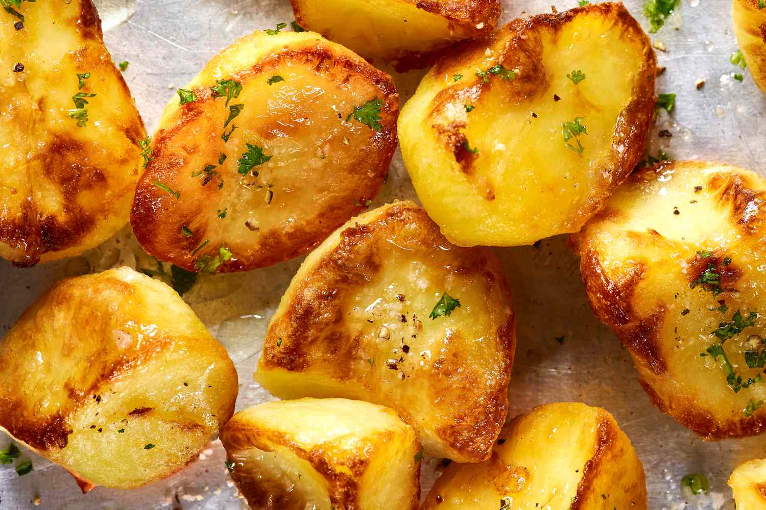 close up - roasted crispy potatoes on a sheet pan