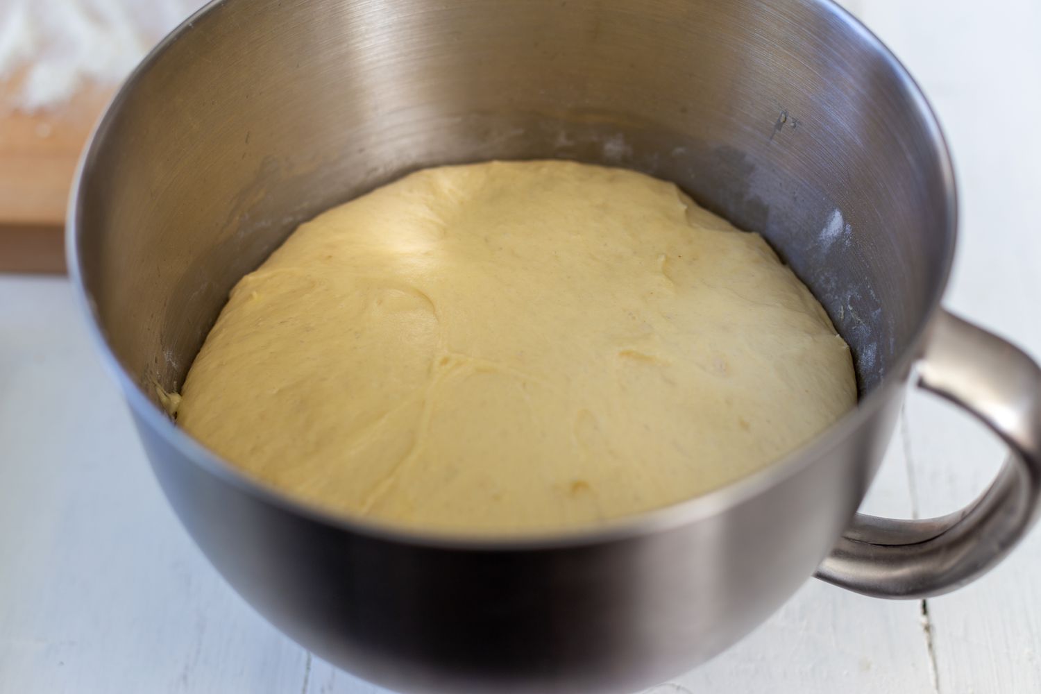 proofed challah dough in bowl