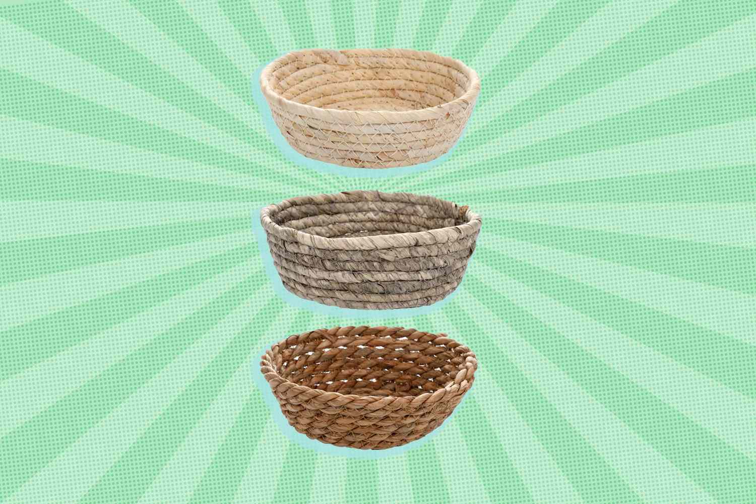 Three woven baskets displayed in a vertical arrangement with a green patterned background
