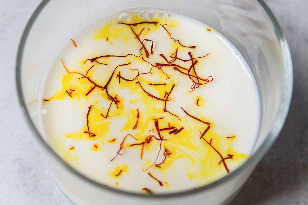 Hyderabadi Chicken Biryani add the saffron to the milk