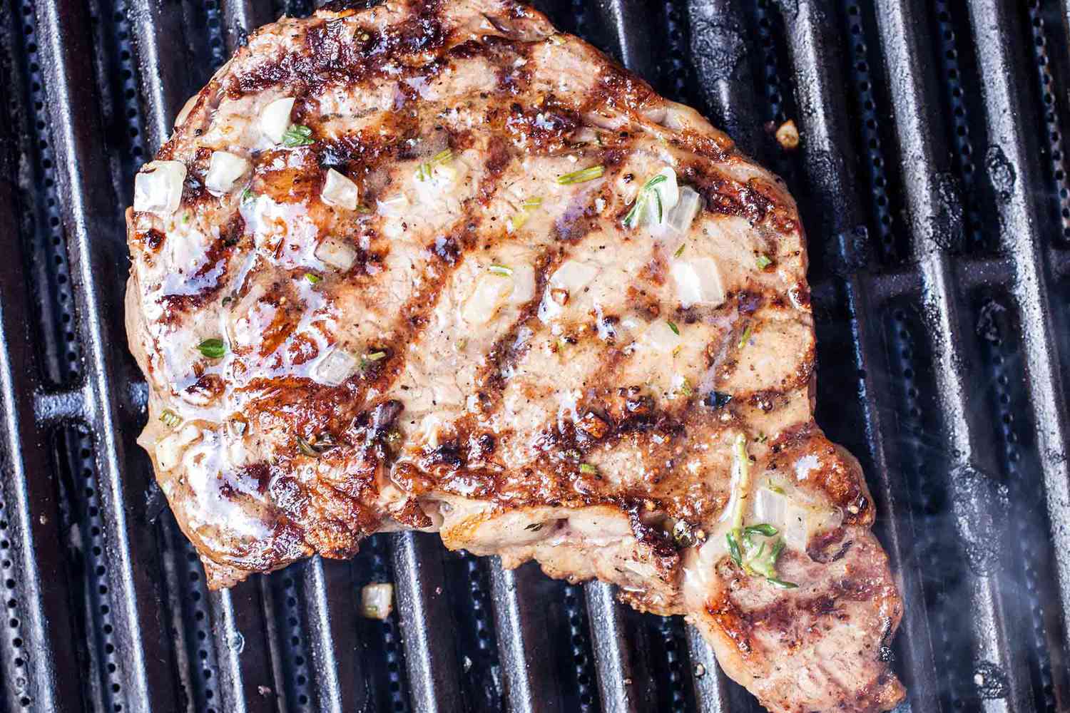 The best grilled steak, basted in butter, on the grill