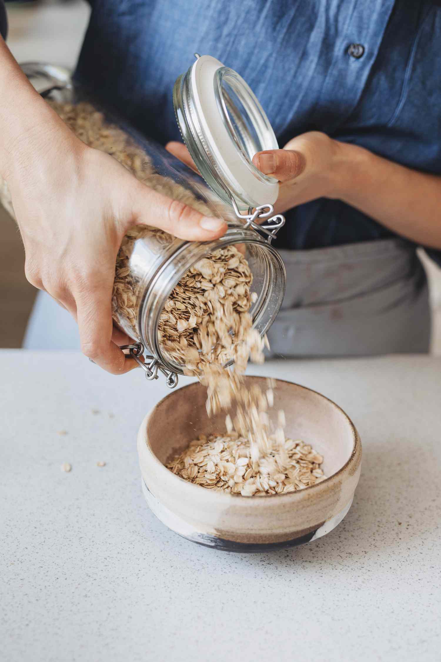 Pouring oats into a bowl