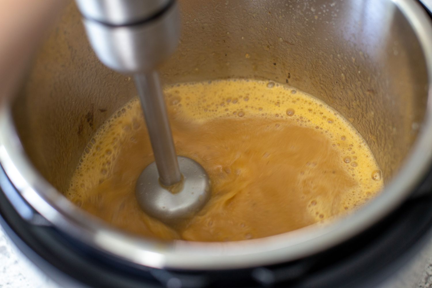 Using an immersion blender to make gravy in an instant pot.