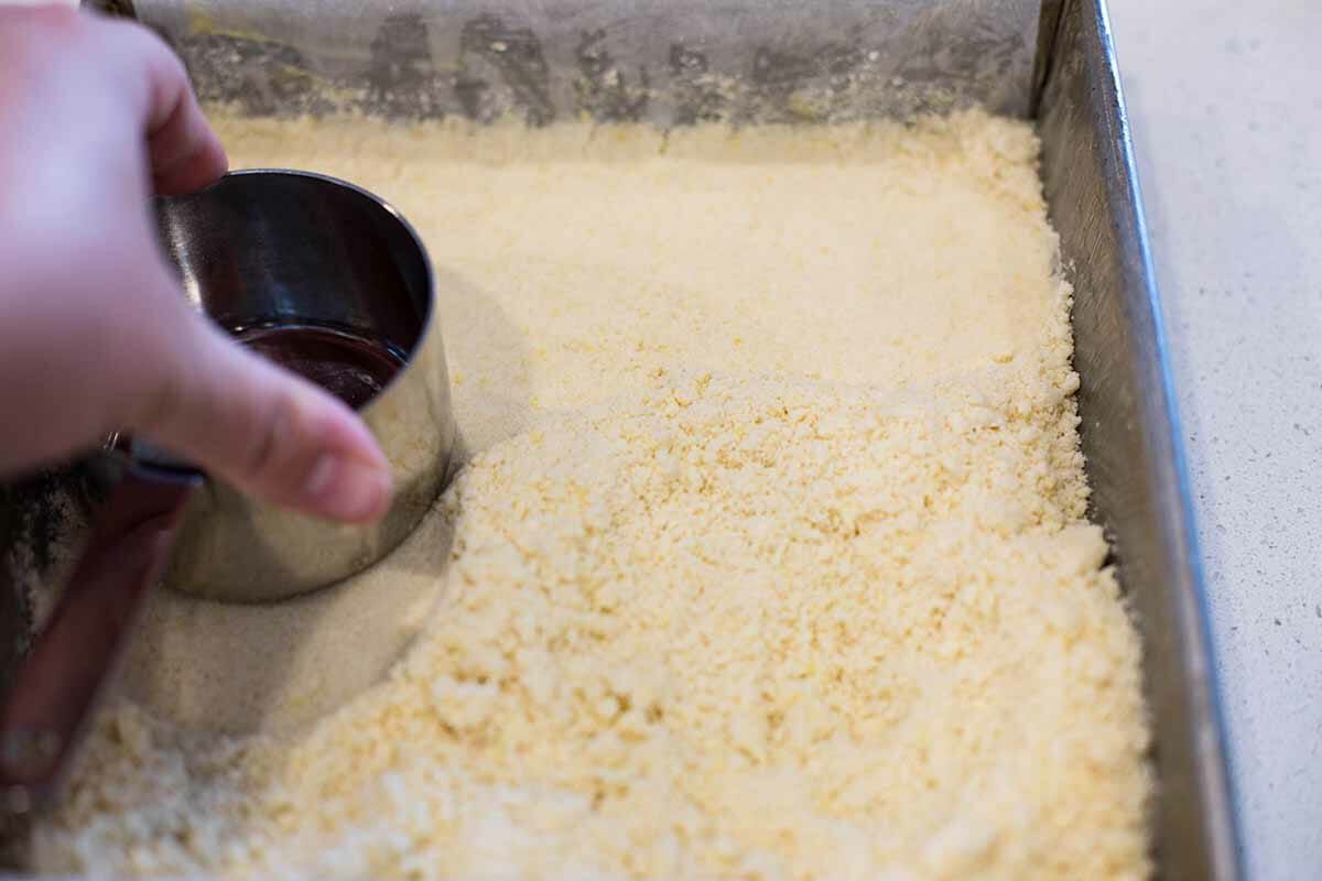 Blueberry Crumb Bars with Shortbread Crust press the crust into the pan