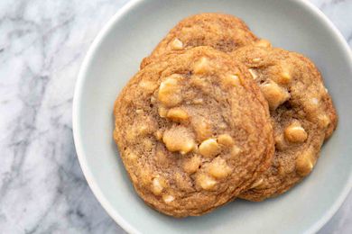 White Chocolate Macadamia Nut Cookies Bird's Eye View of White Chocolate Macadamia Nut Cookies on white plate