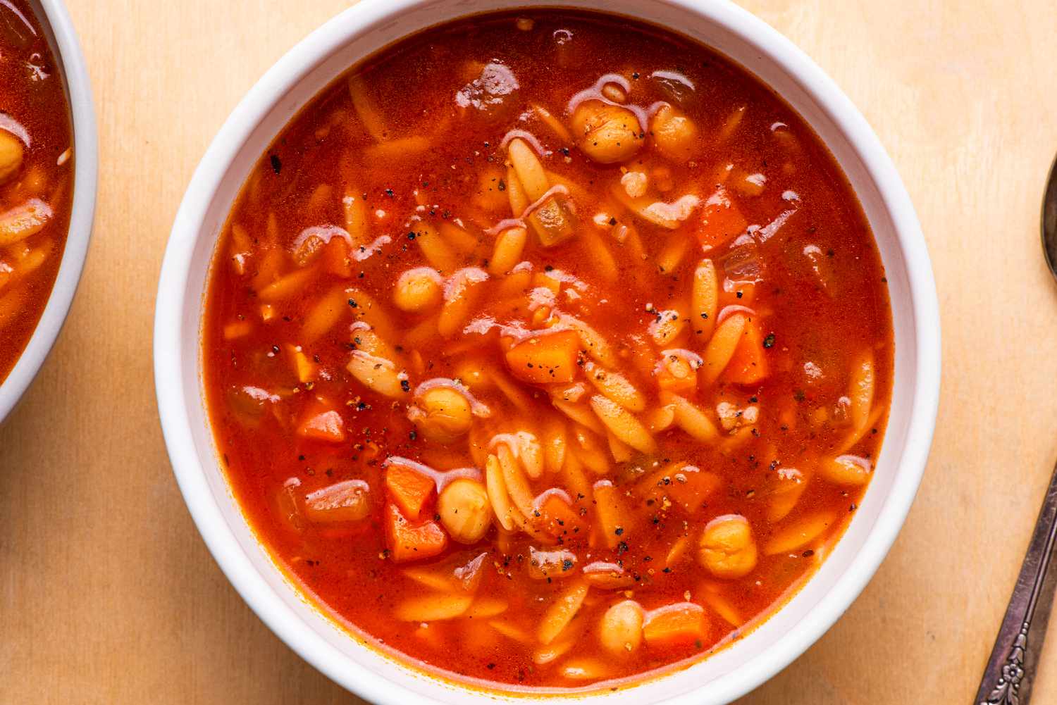 overhead view of a bowl of 20-Minute Tomato Orzo Soup