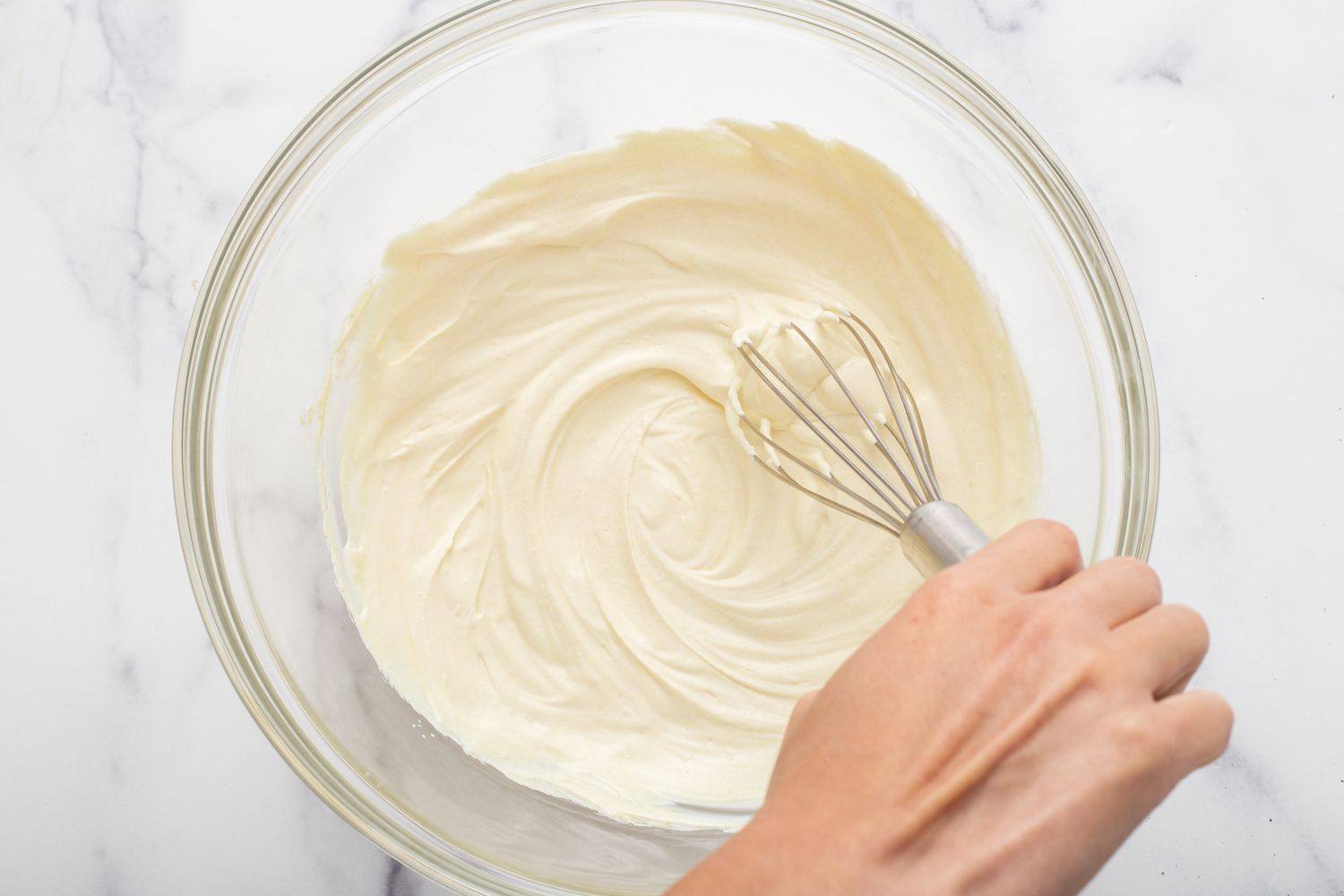 Mixing the dressing for a potato salad recipe.