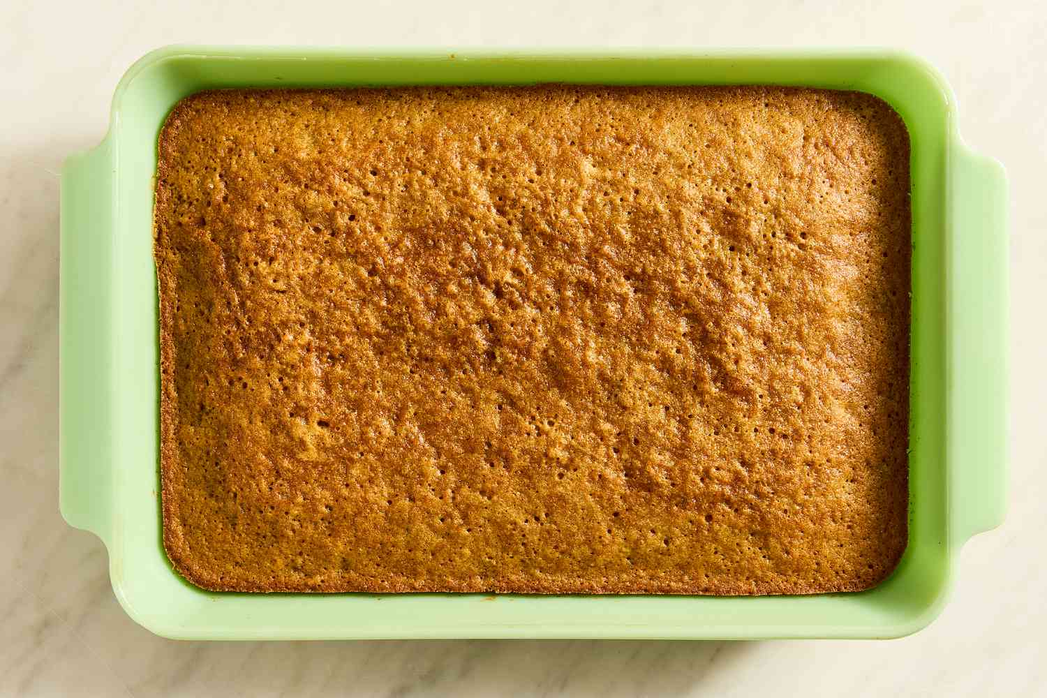 baked cake in a 9x14 baking dish for Grandma’s Oatmeal Cake