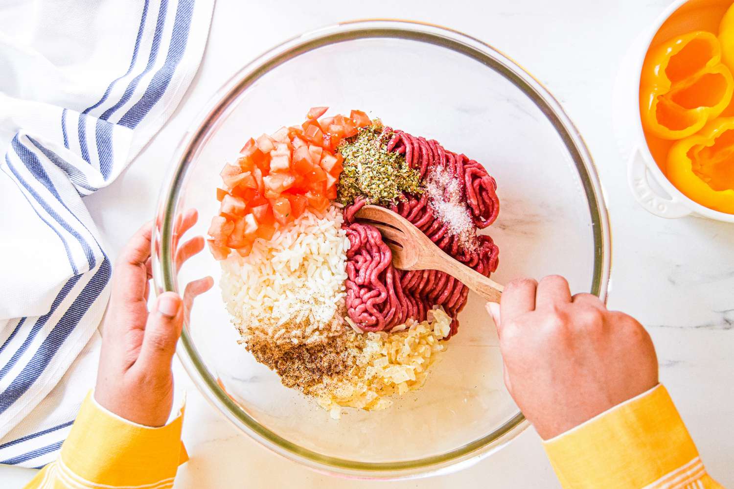 Mixing the beef filling to make a stuffed pepper recipe.