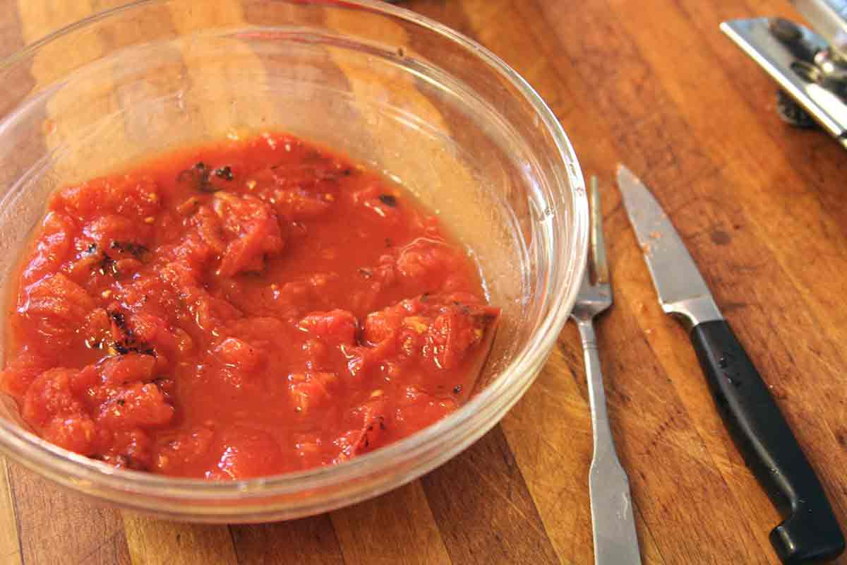 break up the canned tomatoes with your fingers or a fork for salsa