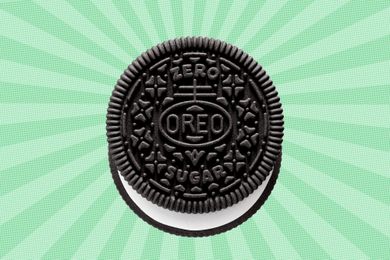 An Oreo cookie marked with zero sugar text on a green radial background