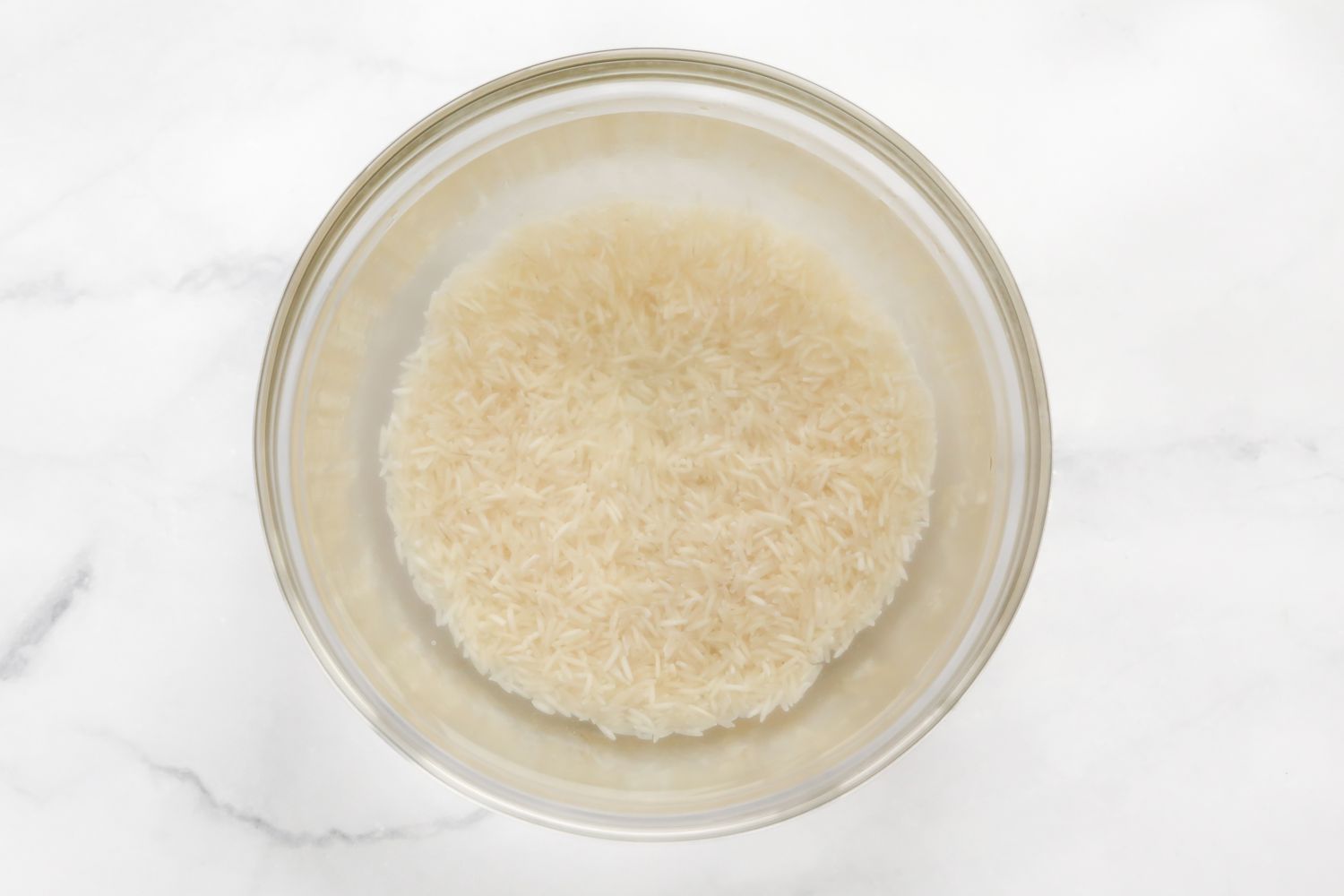 Basmati Rice Soaking in a Bowl of Water for Tahdig Recipe