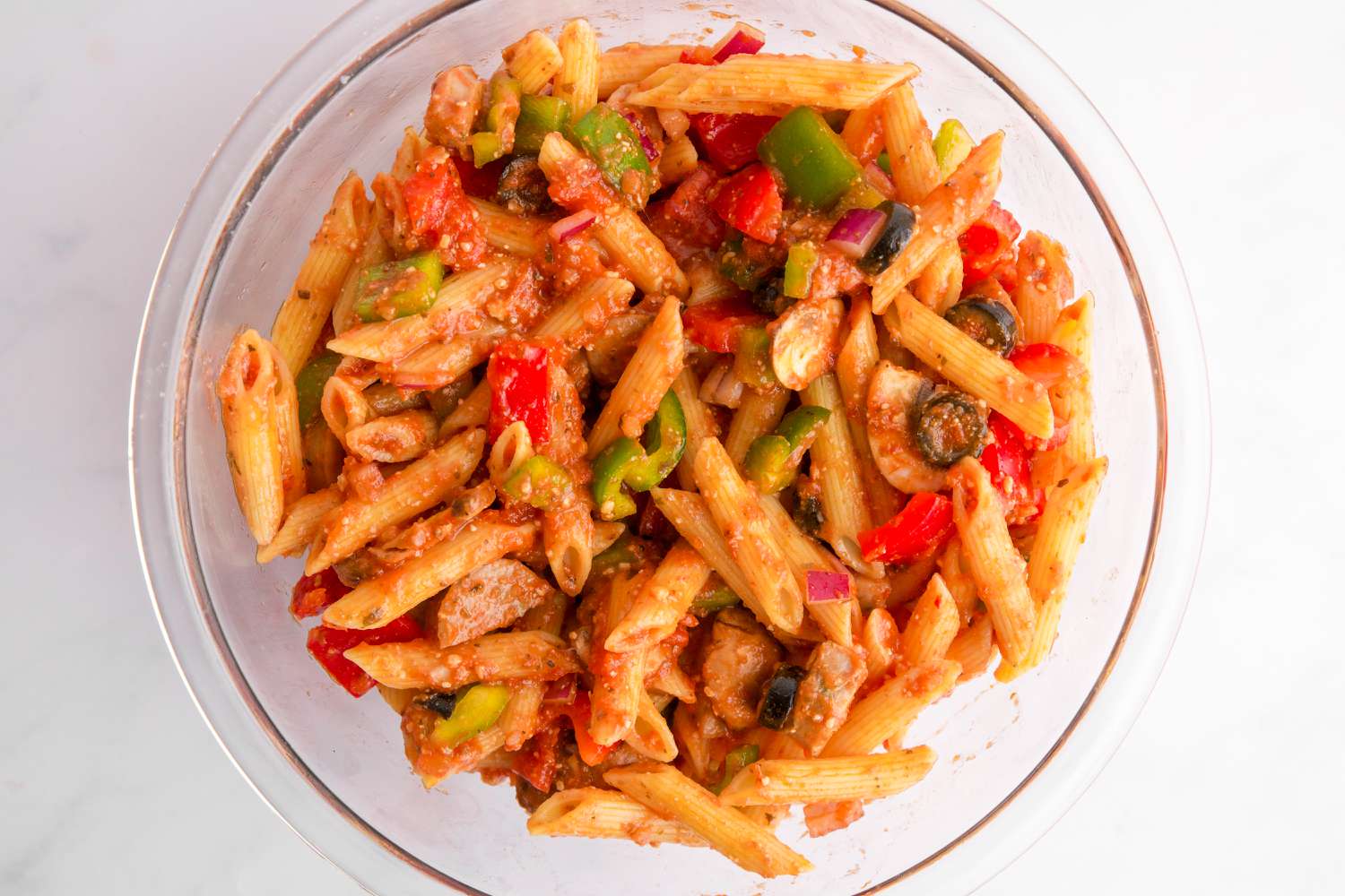 Combine pasta, vegetables, and marinara sauce.