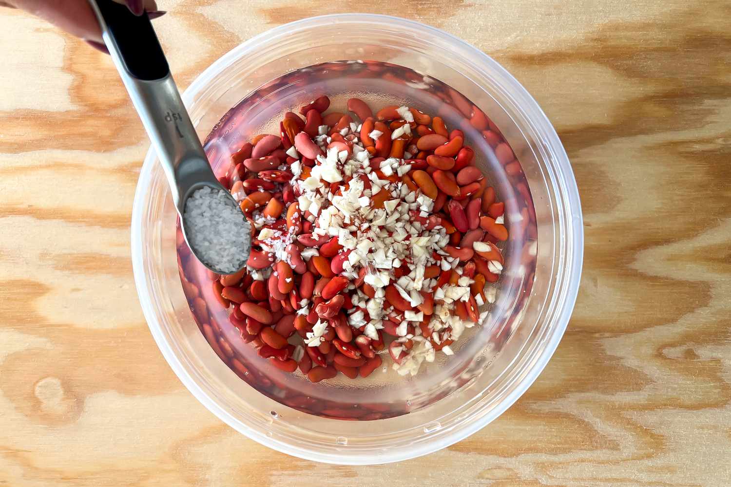 Salt Added to Beans and Garlic for Jamaican Rice and Peas