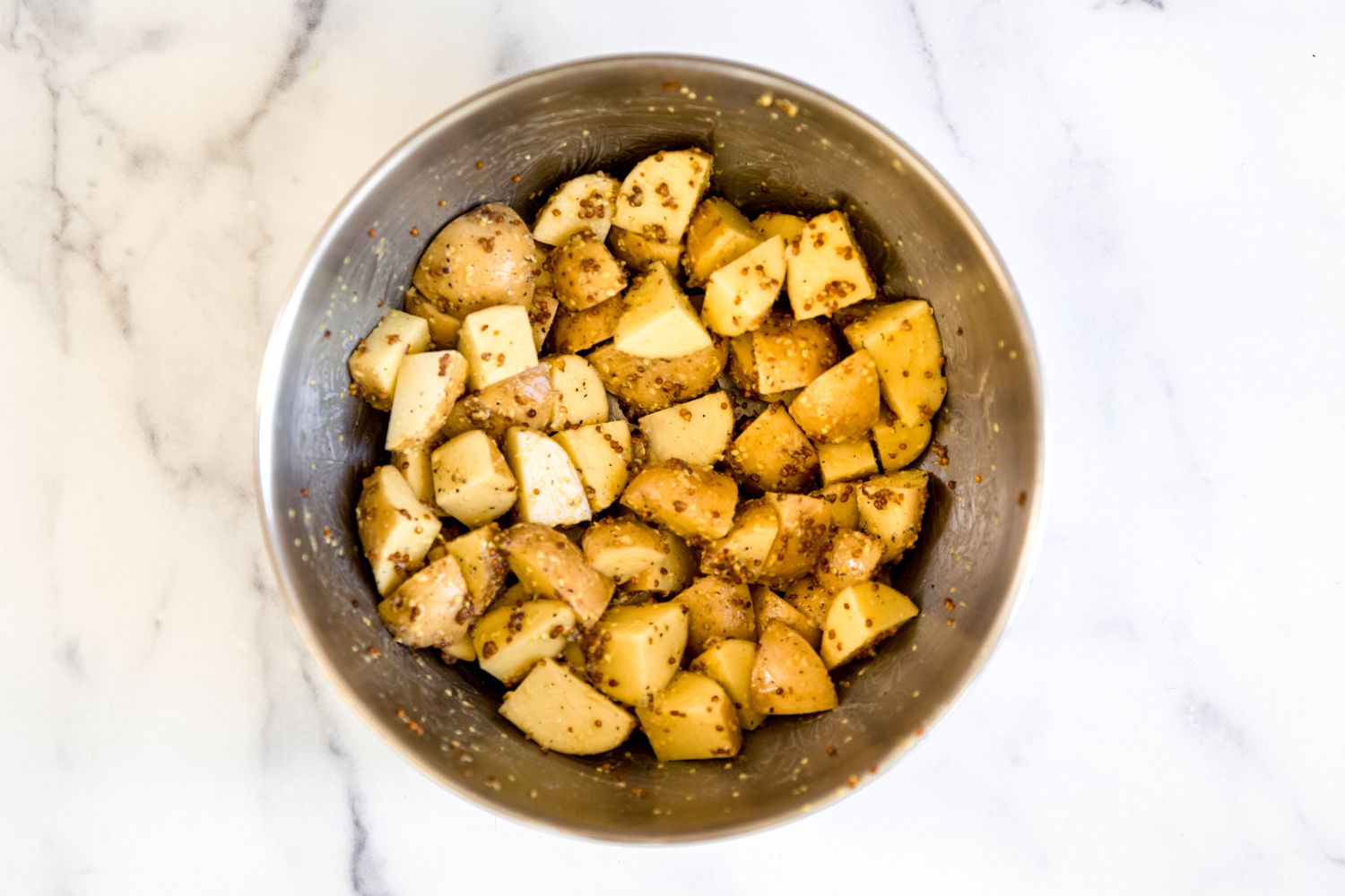 Potatoes in a bowl to make mini barbecue meatloaves with broccoli and mustard glazed potatoes.