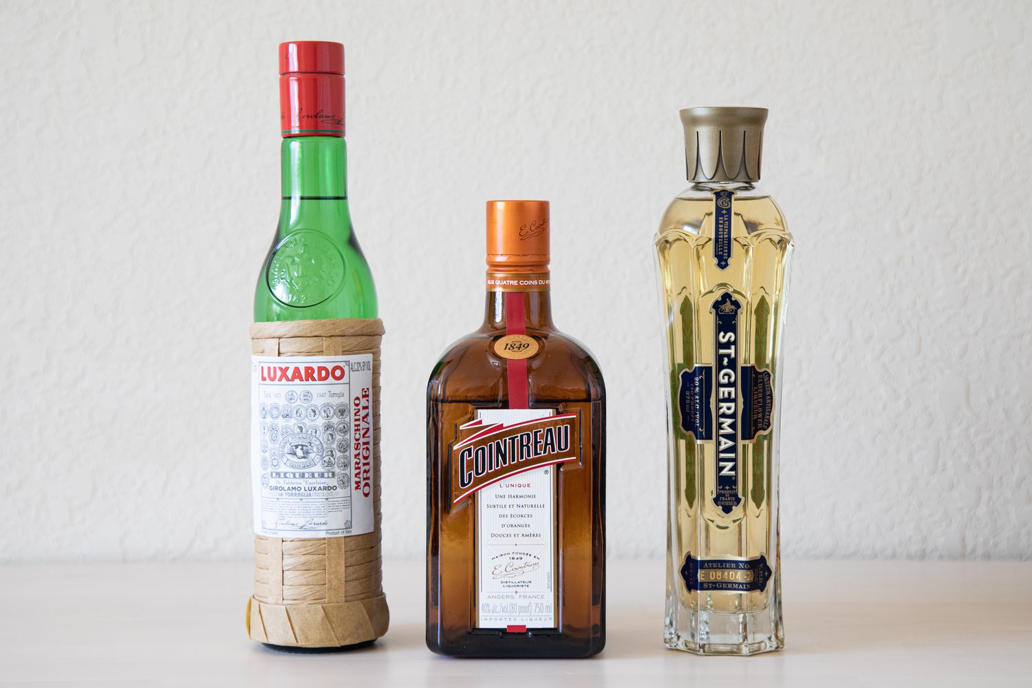 how to stock a home bar essential liqueurs and modifiers