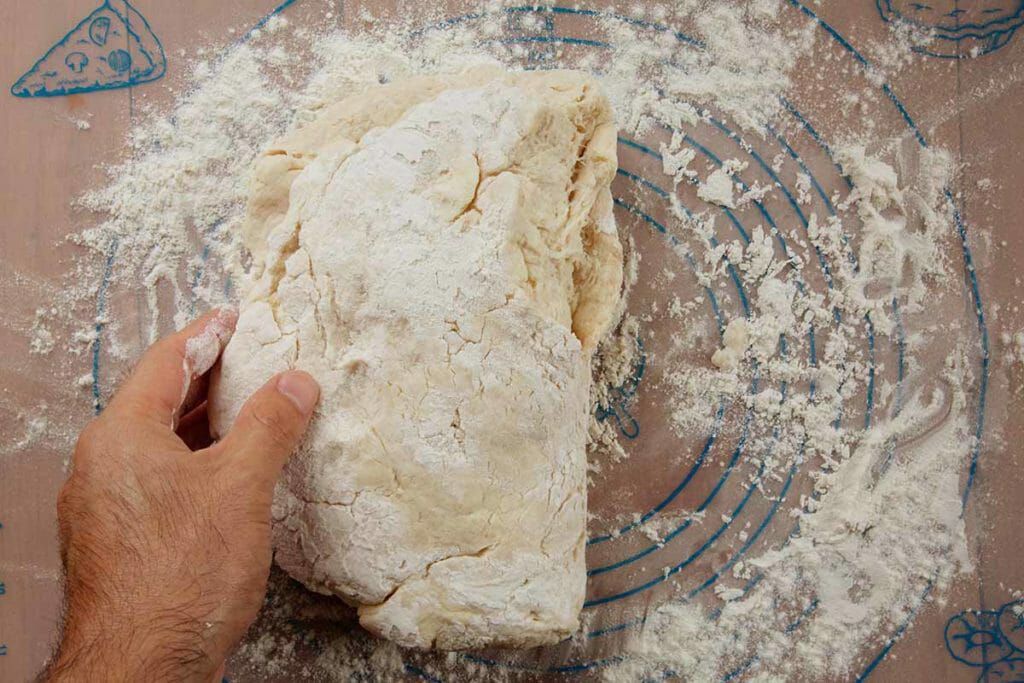 Fold angel biscuit dough then pat then fold over again