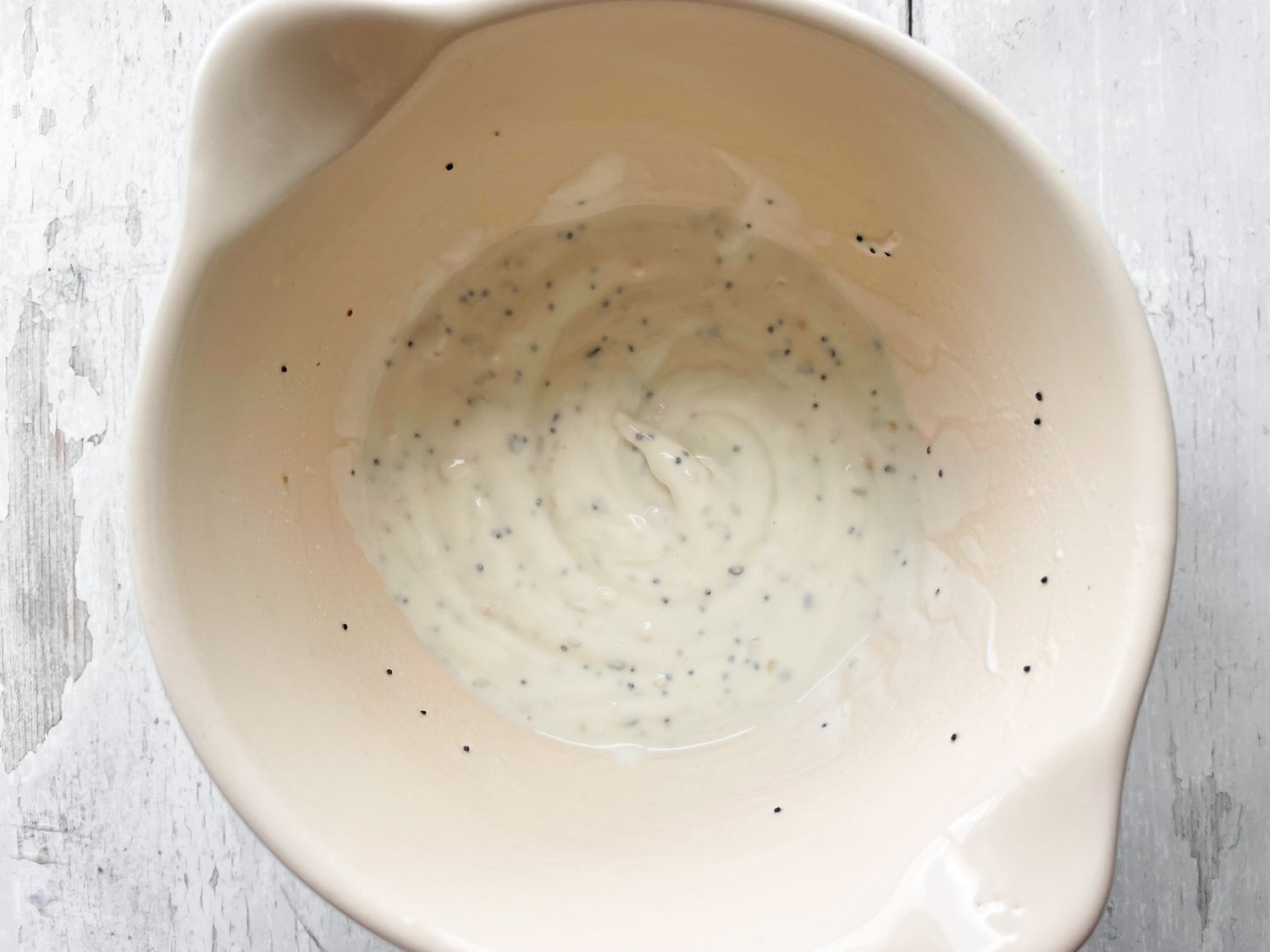 Bowl of Dressing for Everything Bagel Cucumber Salad Recipe 