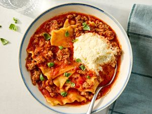 a bowl of Easy Lasagna Soup with a spoon