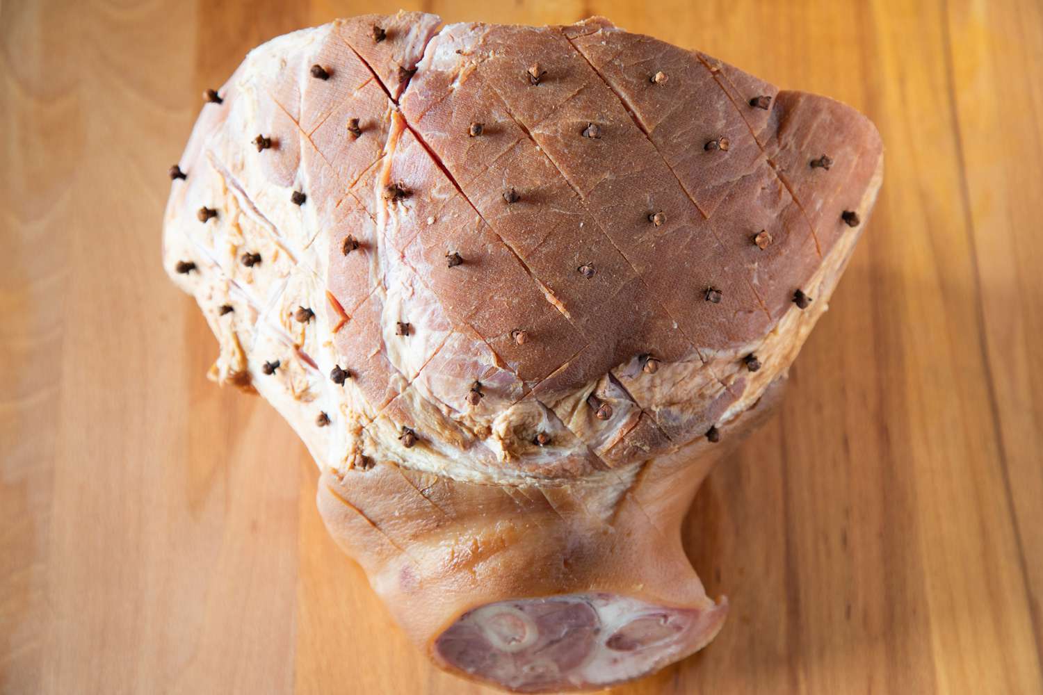 Prepping a ham to show how to cook a ham in the oven.