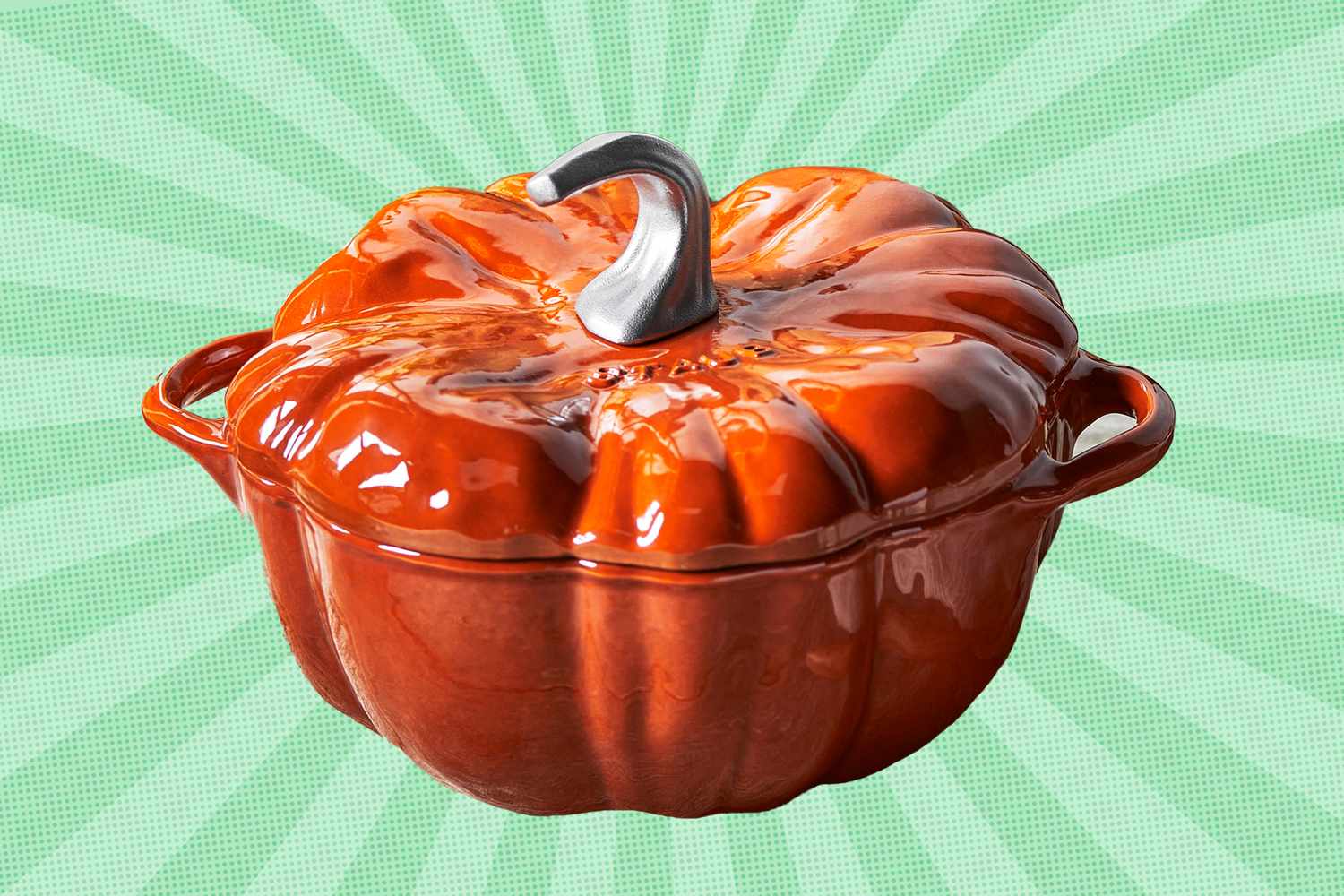 A pumpkinshaped ceramic container with a metal stem lid