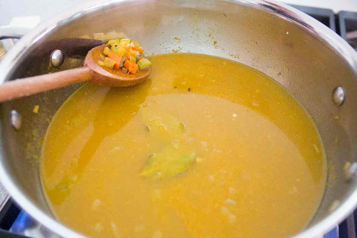 add bay leaves, stock, rice to the base for curried leftover turkey soup