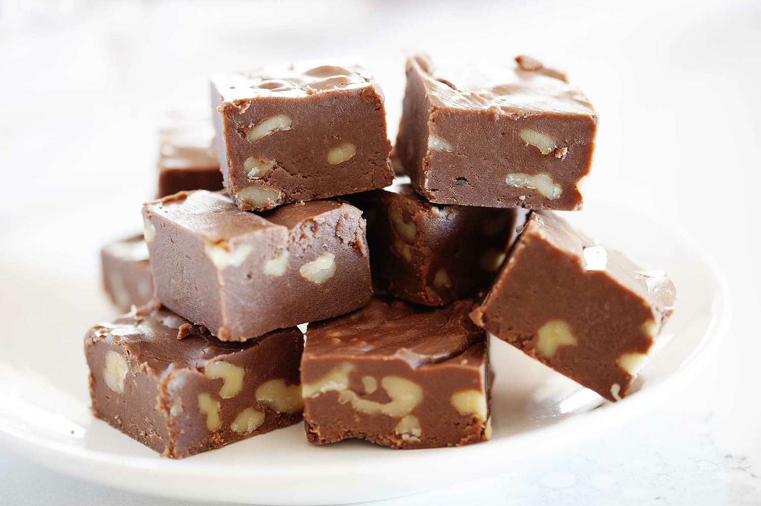 Easy fudge recipe cut into squares and stacked.