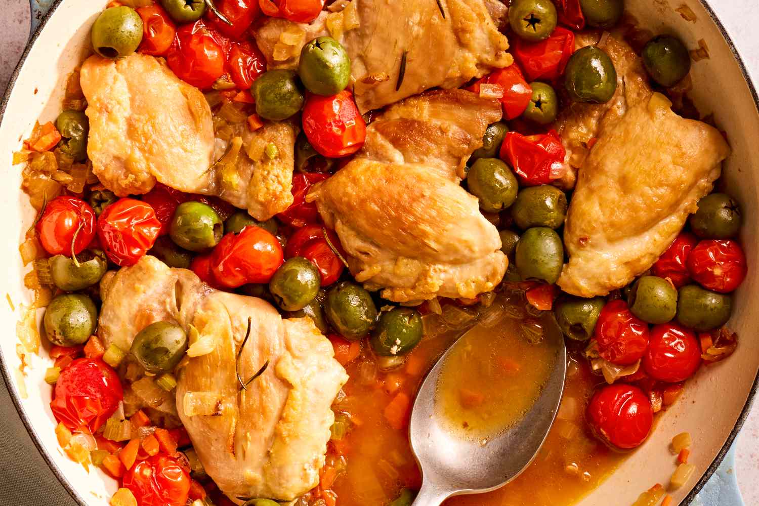Closeup view of a dutch oven of tuscan-style chicken thighs recipe