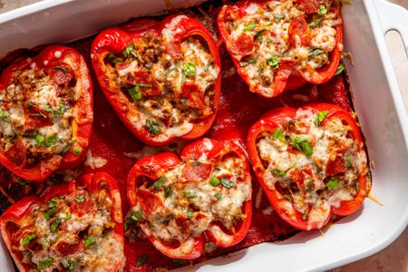 pizza stuffed peppers in a casserole dish