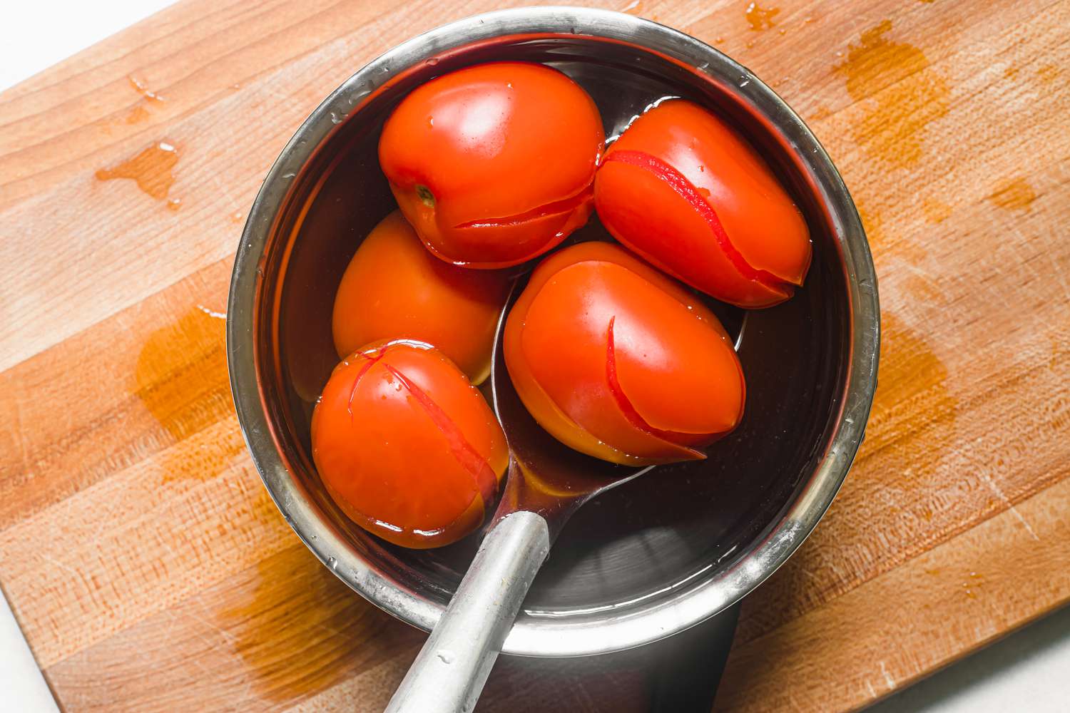 Tomatoes with cracked skin ready to peel