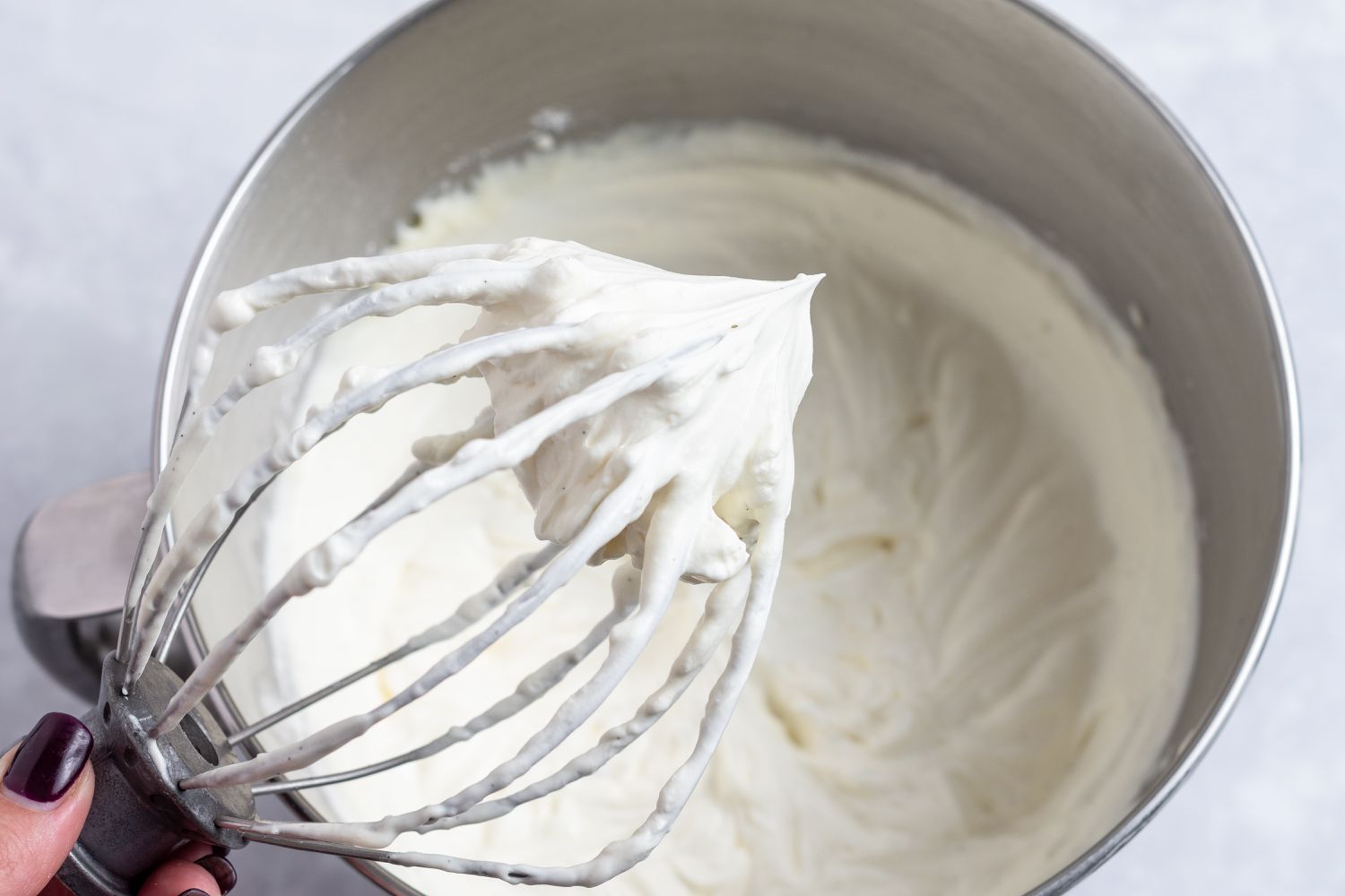 Whisk attachment whipping cream to make the no bake cheesecake filling.