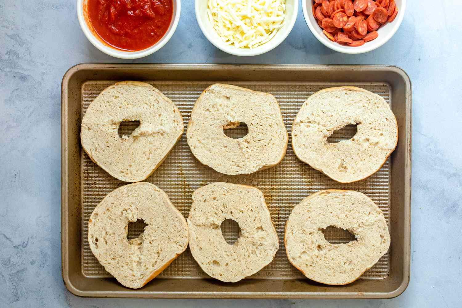 Bagel halves on a sheet pan. 
