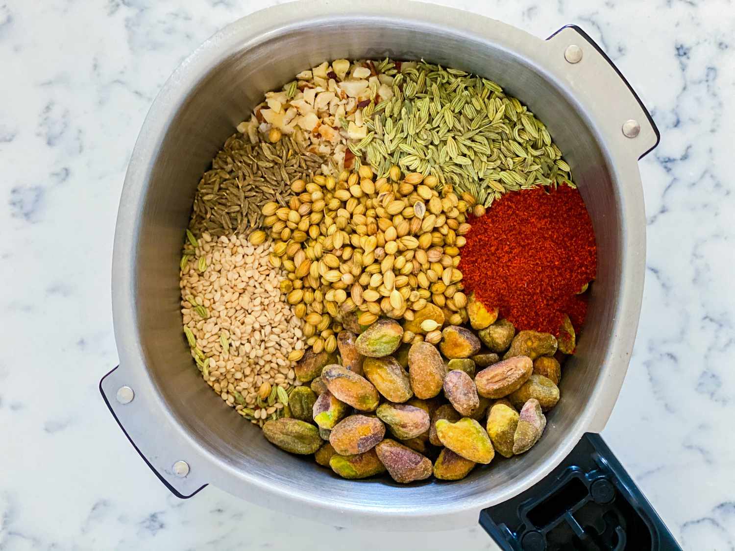 Making Dukkah spice in a spice grinder.