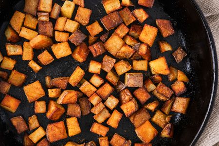 Dinner Style Breakfast Potatoes in a cast iron skillet from above