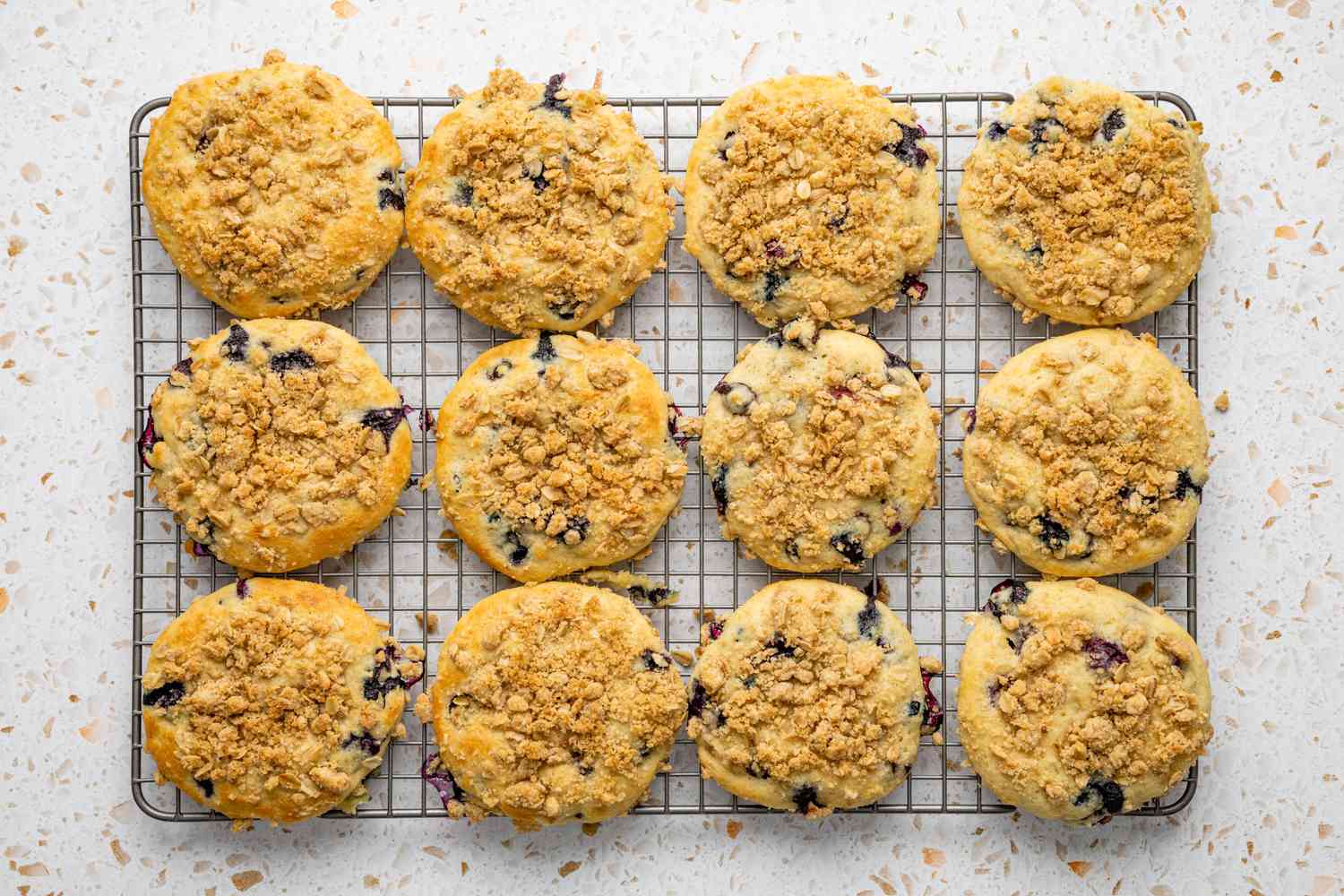 Blueberry Muffin Tops Cooling on a Wire Rack