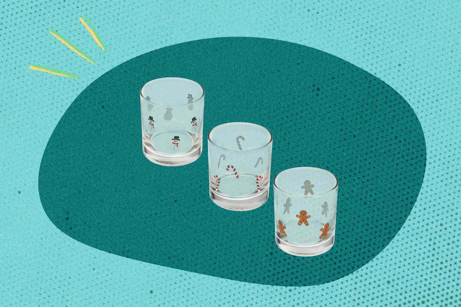 Three festive glasses with holidaythemed designs on a teal background