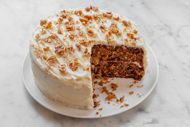 An easy carrot cake recipe with a couple slices missing from the cake.