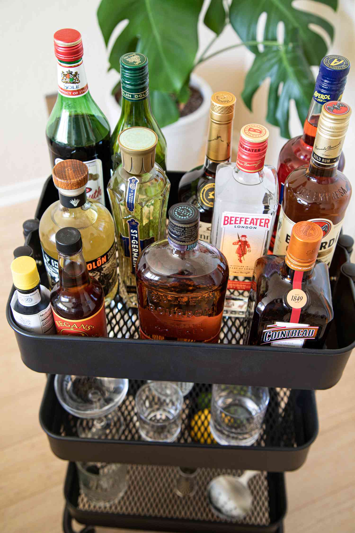 how to stock a home bar and organize it with a bar cart