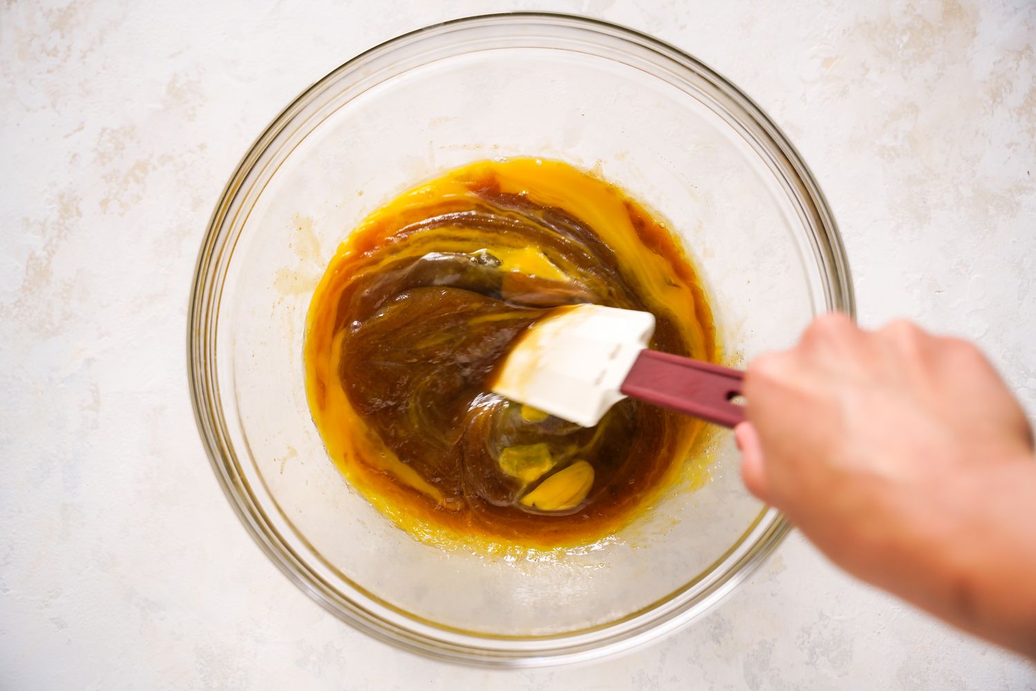 Kitchen Sink Wet Ingredients Mixed Together Using a Spatula for Kitchen Sink Cookies Recipe